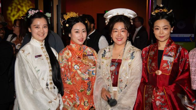 Four women dressed in cultural attire. 